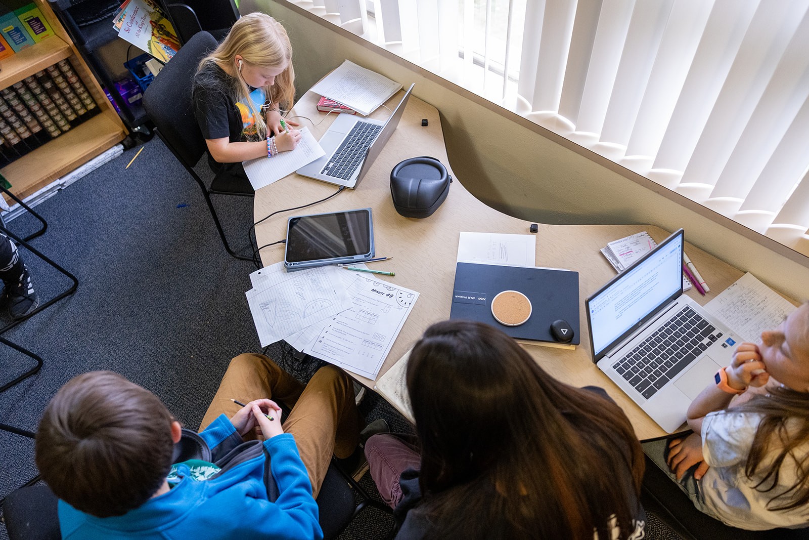 An overhead view of students learning together