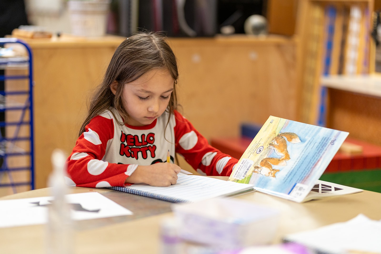 A student reading and writing independently